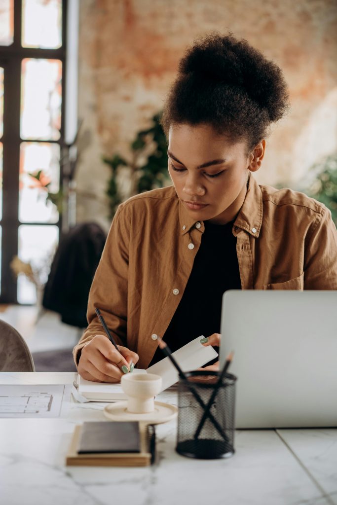 Virtual Administrative Assistant Working At Her Desk