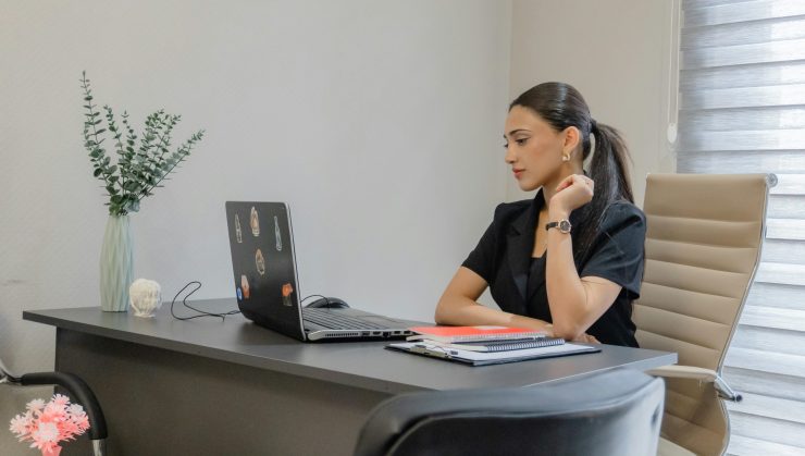 Executive Assistant For Financial Advisors In Her Home Office