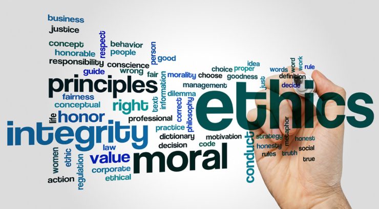 Word cloud with ethics, integrity, principles, moral and conduct as a hand writes the word ethics