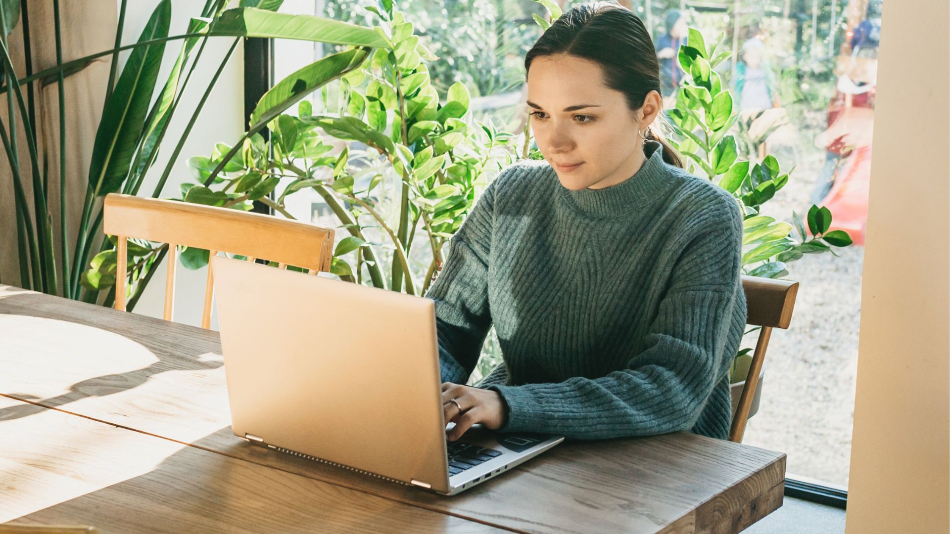 Professional working on a laptop at a table