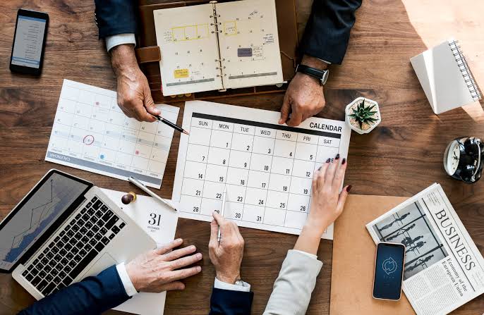 Virtual assistant preparing agendas and briefs before an executive meeting