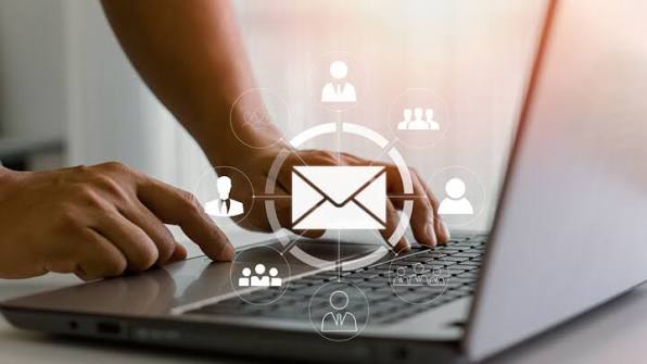 Executive responding to emails on a laptop